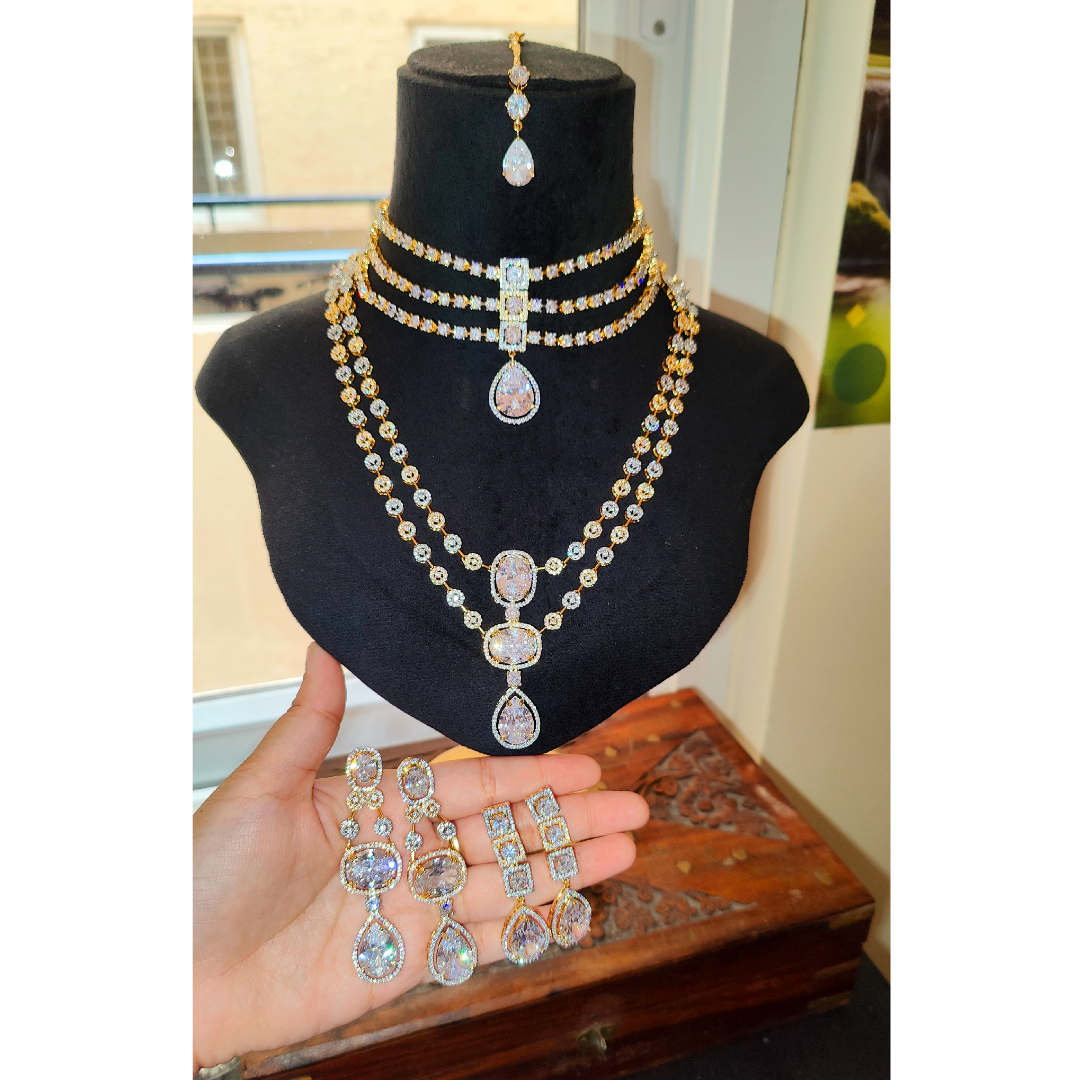 Ritta's Collections Elegant American Diamond Bridal Jewellery, 1 short necklace, 1 medium to long necklace with 2 Pair of earrings and 1 maangtikka, golden silver ganga Jamuna polish